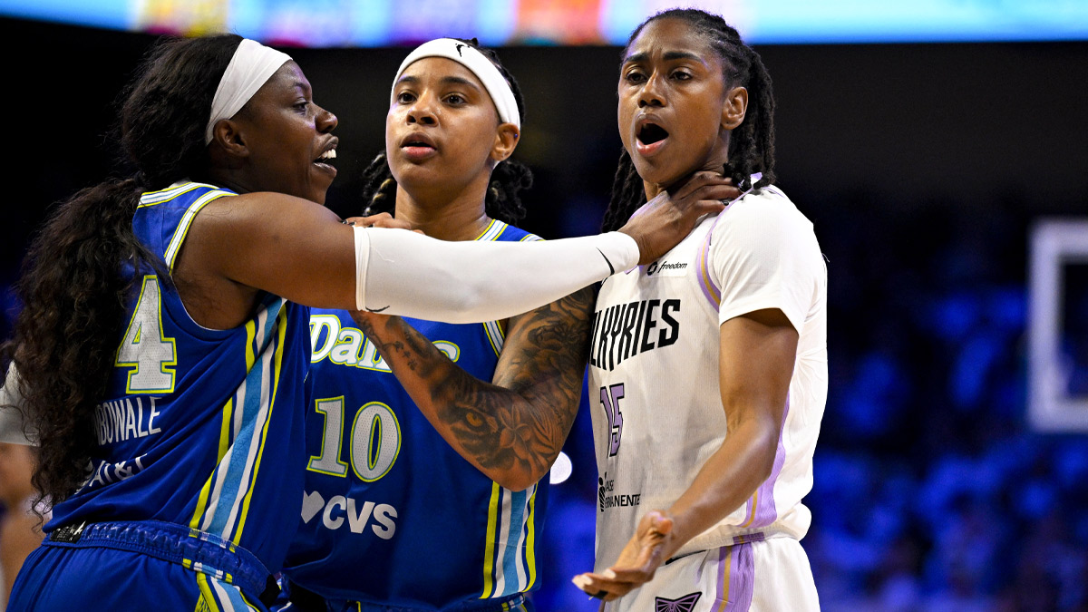 Dallas Wings guard Arike Ogunbowale (24) pushes Golden State Valkyries guard Tiffany Hayes (15) as guard Aziaha James (10) looks on during overtime during game two of the first round for the 2026 WNBA Playoffs at College Park Center.