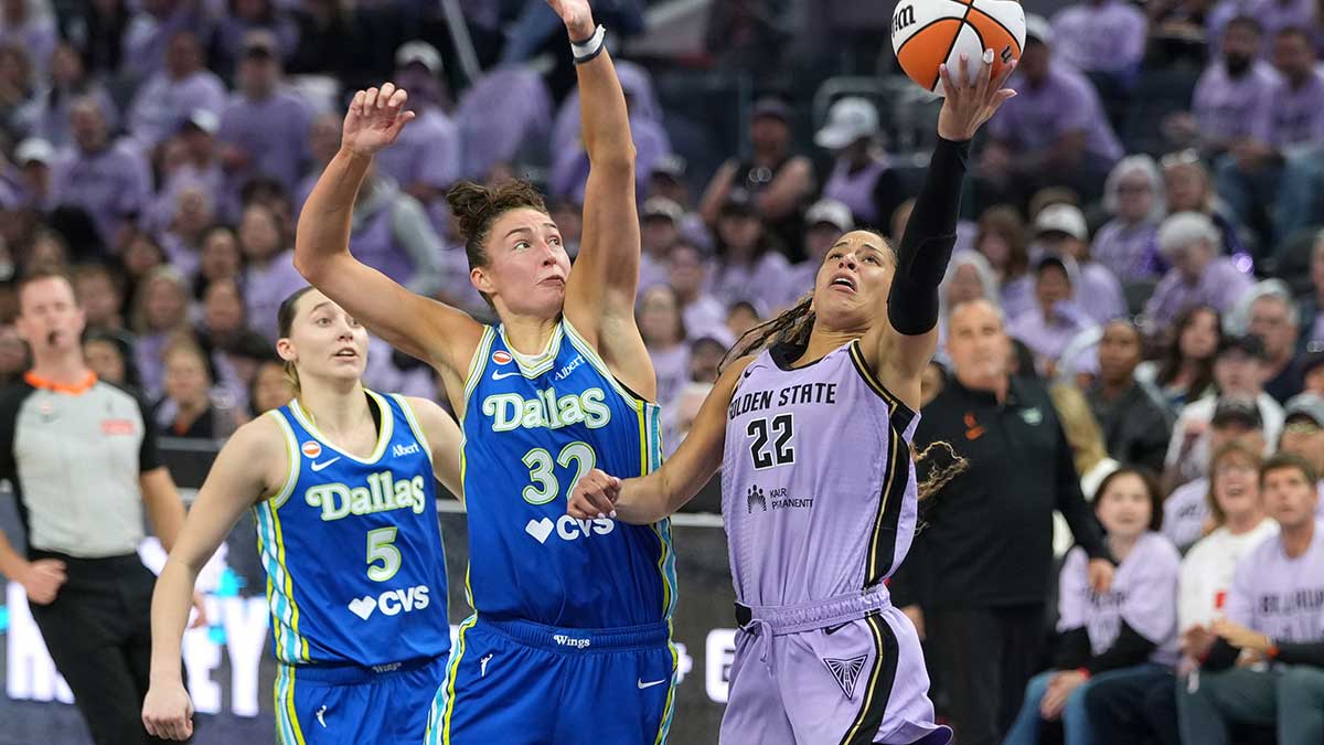 Oct 2, 2026; San Francisco, California, USA; Golden State Valkyries guard Veronica Burton (22) shoots against Dallas Wings forward Jessica Shepard (32) during the second quarter of game three of the first round for the 2026 WNBA Playoffs at Chase Center. Mandatory Credit: Darren Yamashita-Imagn Images