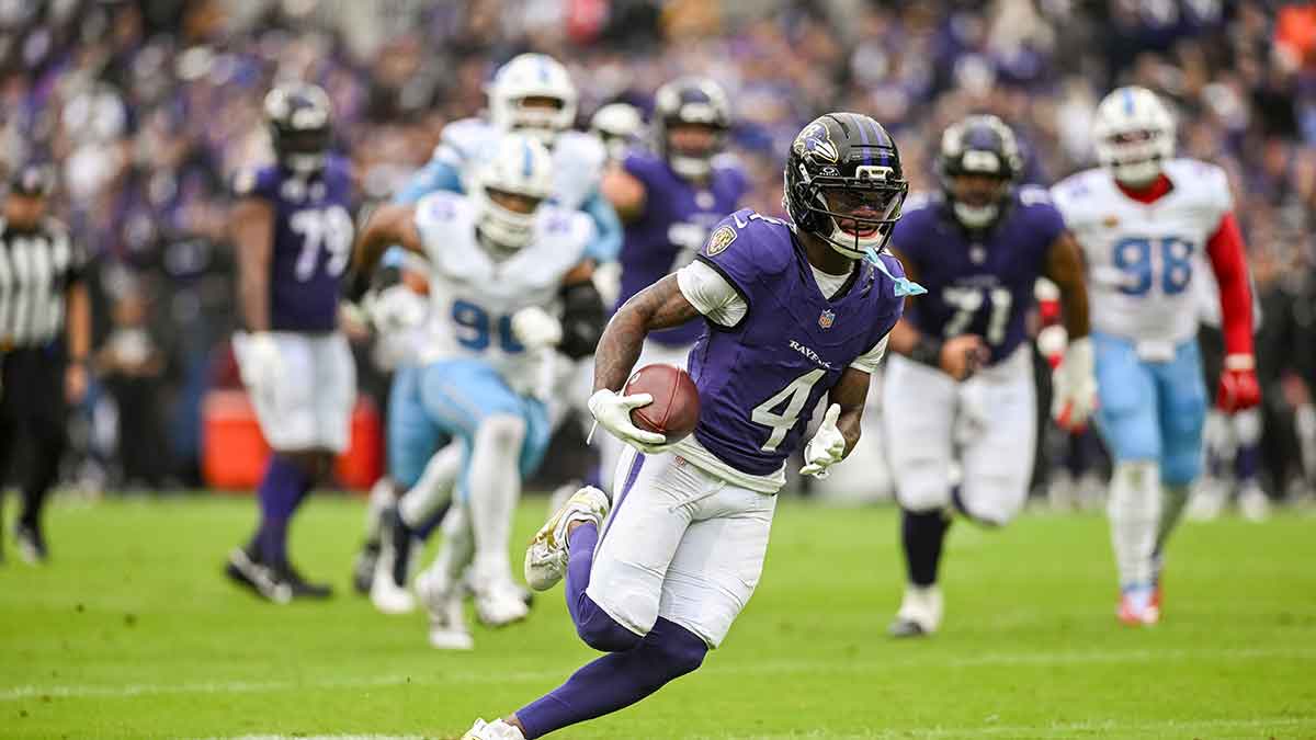 Oct 4, 2026; Baltimore, Maryland, USA; Baltimore Ravens wide receiver Zay Flowers (4) runs after a catch for a first half touchdown against the Tennessee Titans at M&T Bank Stadium.